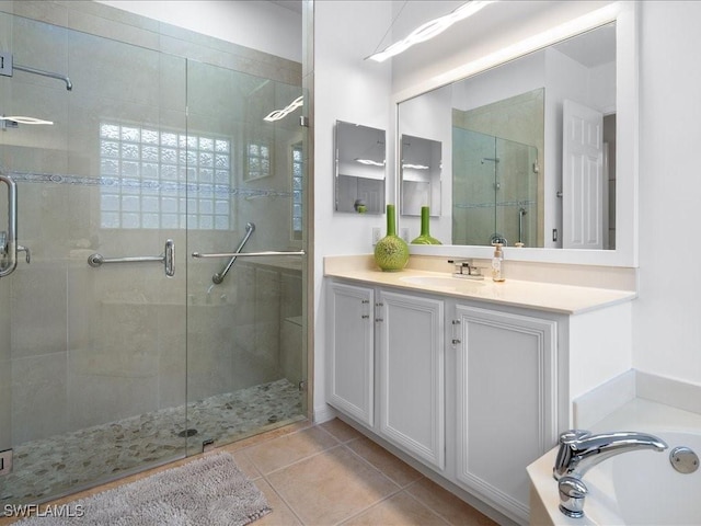 bathroom with plus walk in shower, vanity, and tile patterned floors