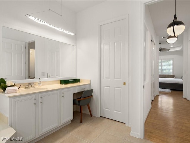 bathroom featuring tile patterned floors, ceiling fan, and vanity