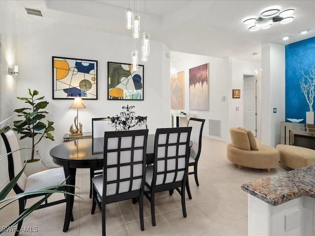 dining area featuring light tile patterned flooring