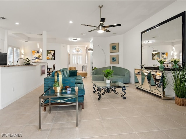 tiled living room featuring ceiling fan