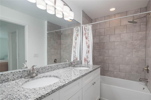 bathroom with vanity and shower / bathtub combination with curtain