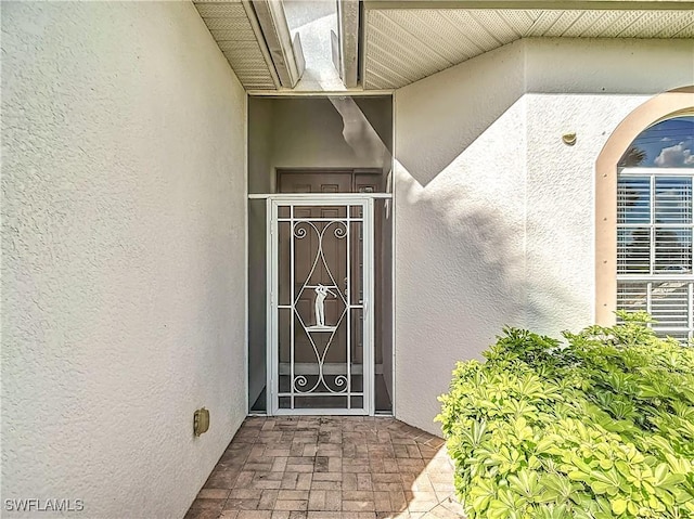 2505 Keystone Lake Dr, Cape Coral, FL 33909 - view of exterior entry featuring stucco siding