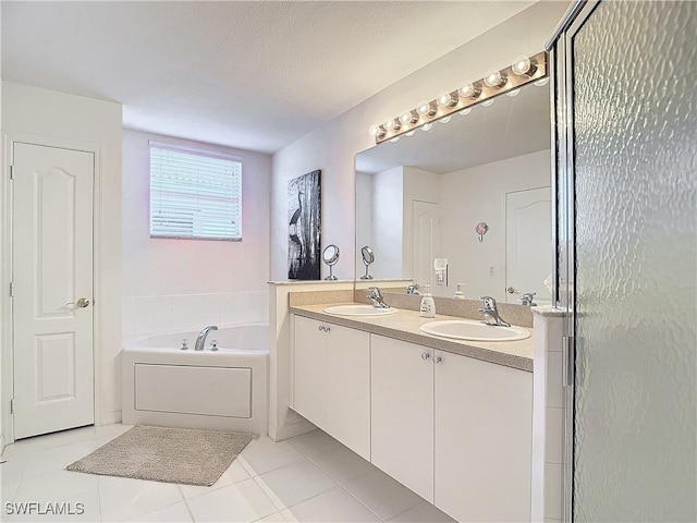 bathroom featuring vanity, shower with separate bathtub, a textured ceiling, and tile patterned flooring