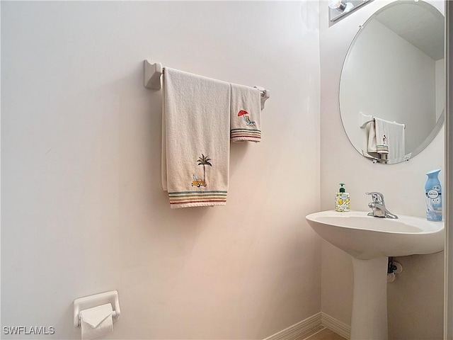 2505 Keystone Lake Dr, Cape Coral, FL 33909 - bathroom featuring baseboards