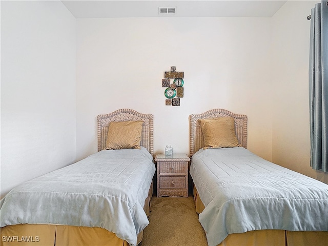 bedroom featuring light colored carpet