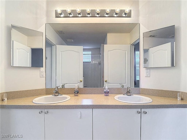 2505 Keystone Lake Dr, Cape Coral, FL 33909 - full bath with double vanity, visible vents, and a sink
