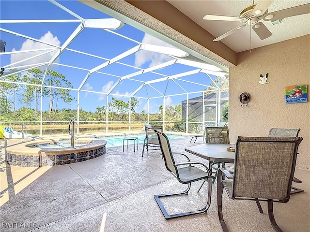 view of patio / terrace featuring ceiling fan, a pool with hot tub, and a lanai