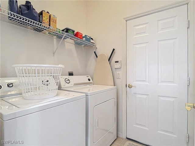2505 Keystone Lake Dr, Cape Coral, FL 33909 - washroom with laundry area and washer and clothes dryer