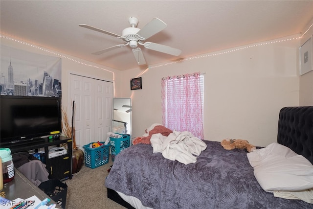 carpeted bedroom with a closet and ceiling fan