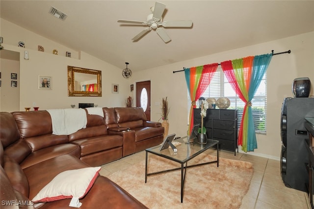 tiled living room with lofted ceiling and ceiling fan