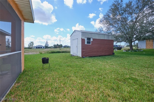 view of yard with a storage unit