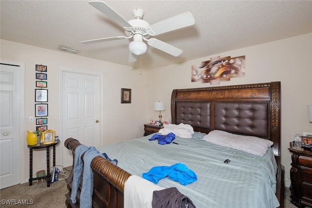 bedroom with ceiling fan and carpet