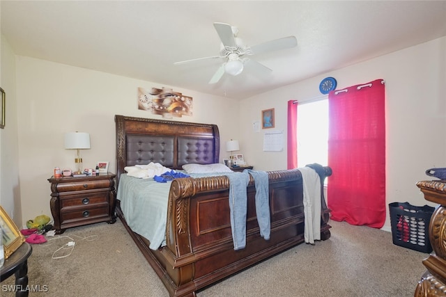 bedroom featuring light carpet and ceiling fan