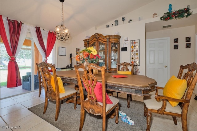 dining room featuring vaulted ceiling, a notable chandelier, and light tile patterned floors