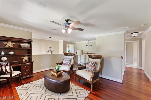 living area featuring crown molding, ceiling fan with notable chandelier, and dark hardwood / wood-style flooring