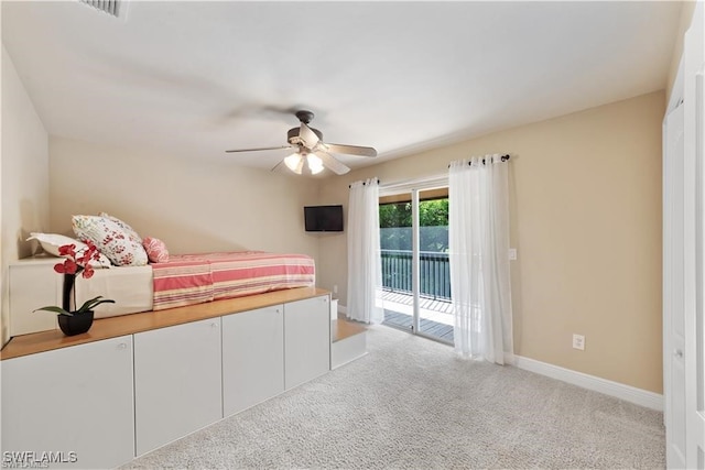 carpeted bedroom with access to outside and ceiling fan