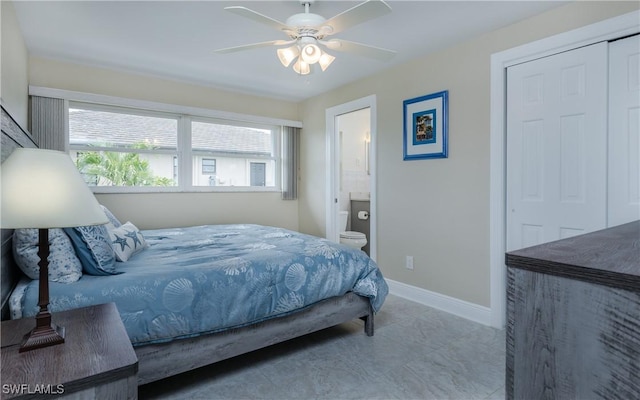 bedroom featuring ceiling fan, a closet, and ensuite bath