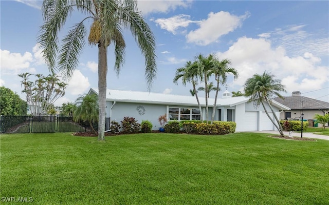 single story home with a front yard and a garage