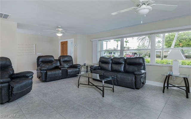 living room with ceiling fan, a healthy amount of sunlight, and light tile patterned floors