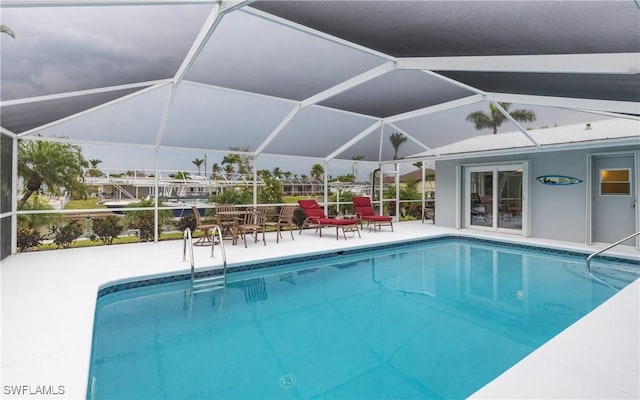 view of pool featuring a lanai and a patio area