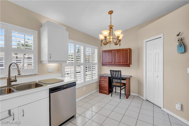 kitchen with sink, light tile patterned floors, dishwasher, decorative light fixtures, and a chandelier