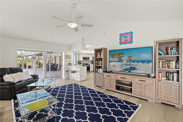 living room with lofted ceiling, wood-type flooring, and ceiling fan