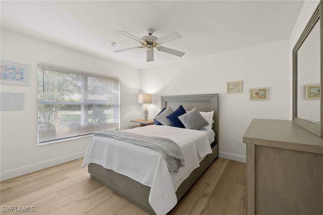 bedroom featuring light wood-type flooring and ceiling fan