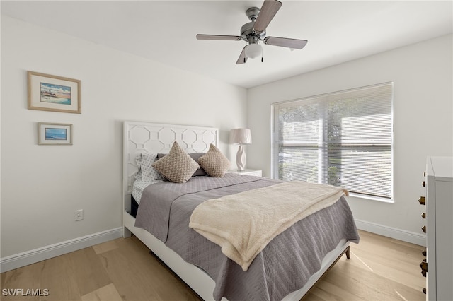 bedroom featuring light hardwood / wood-style flooring and ceiling fan