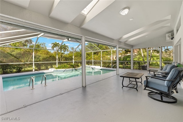 view of swimming pool with a patio area and a lanai