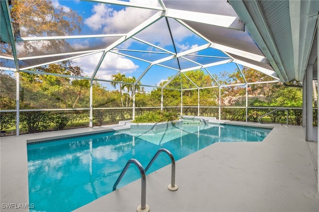 view of pool with a patio area and a lanai