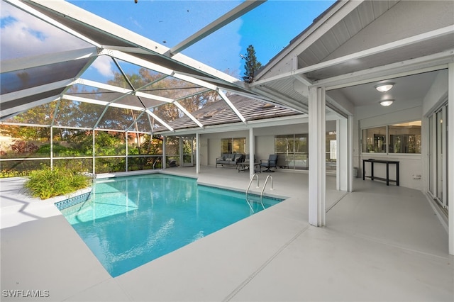 view of pool featuring a patio area and a lanai