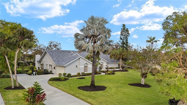 view of side of property with a lawn