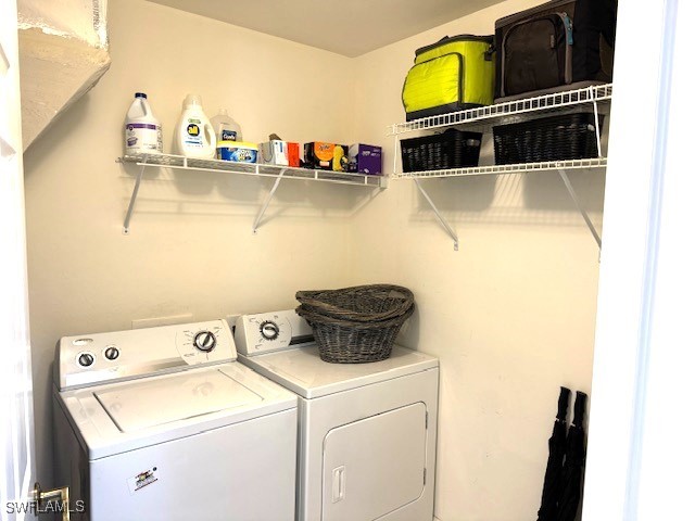 washroom featuring washer and dryer