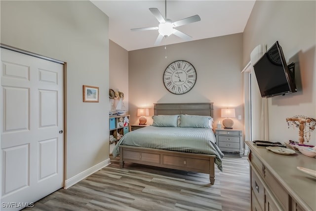 bedroom featuring light hardwood / wood-style floors and ceiling fan