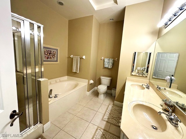 full bathroom featuring vanity, plus walk in shower, toilet, and tile patterned flooring