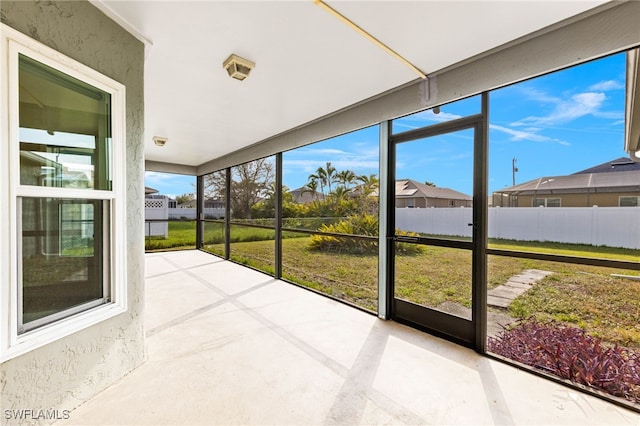 unfurnished sunroom with a wealth of natural light