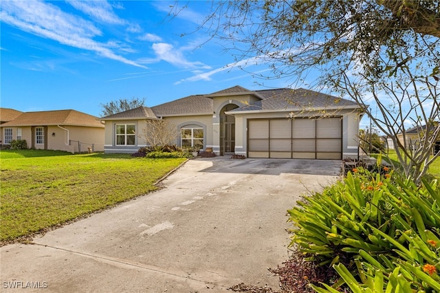 view of front of house featuring a front lawn and a garage