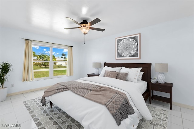 bedroom with light tile patterned floors and ceiling fan