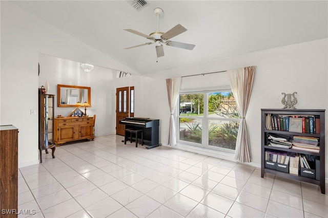 interior space with ceiling fan, light tile patterned floors, and vaulted ceiling