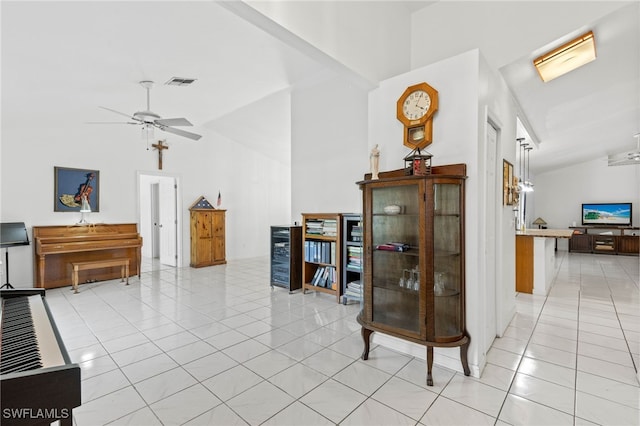 interior space featuring vaulted ceiling and light tile patterned floors