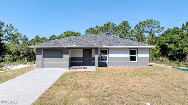 ranch-style house with a front yard and a garage