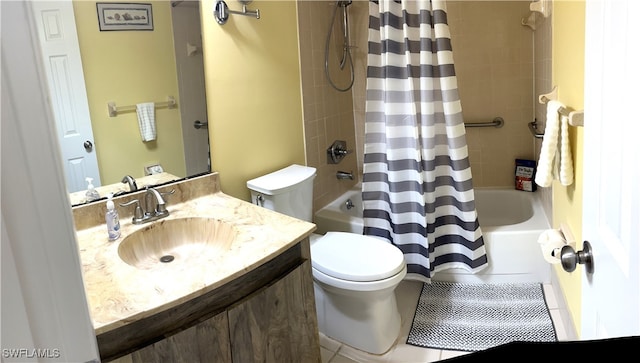 full bathroom featuring tile patterned flooring, vanity, toilet, and shower / tub combo