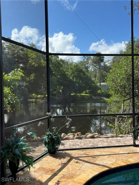 view of swimming pool featuring a water view