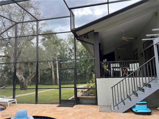 sunroom featuring plenty of natural light and ceiling fan