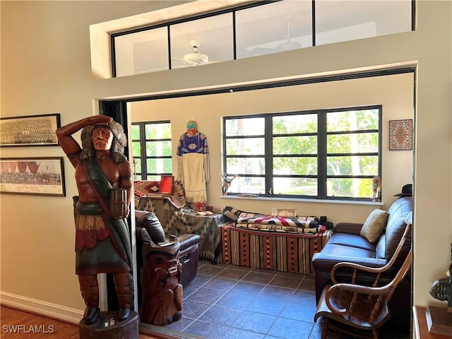 sitting room featuring baseboards