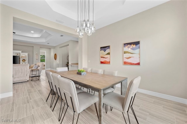 4365 Caldera Cir, Naples, FL 34119 - dining space with a tray ceiling, baseboards, wood tiled floors, and recessed lighting