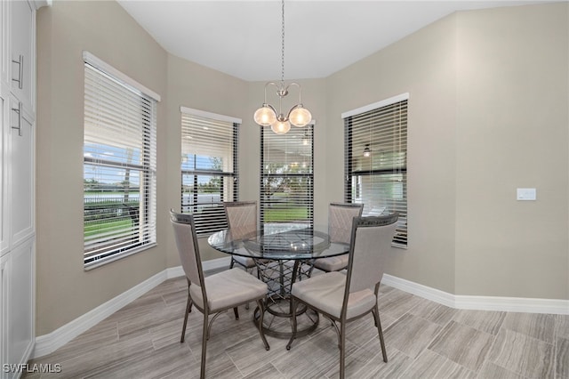 dining room with a notable chandelier