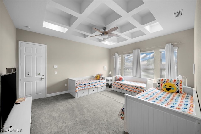 carpeted bedroom featuring ceiling fan, coffered ceiling, and beam ceiling