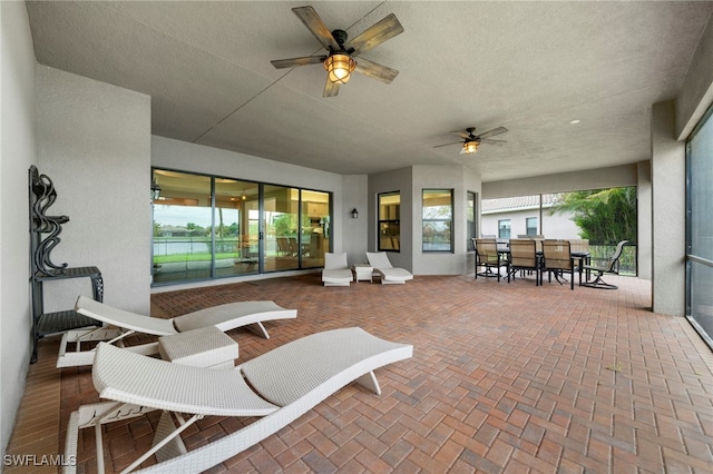 view of patio featuring ceiling fan