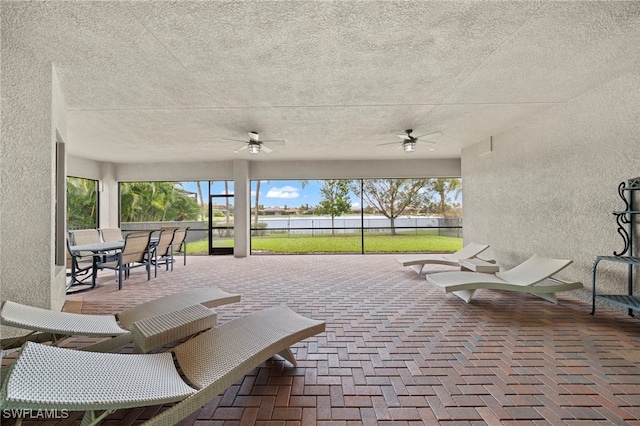 4365 Caldera Cir, Naples, FL 34119 - view of patio featuring ceiling fan and a water view